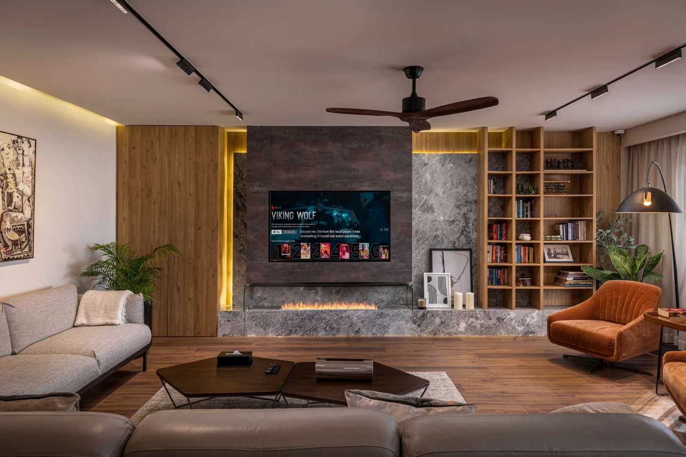 Custom media wall with stone cladding and oak shelving, living room by Modoro