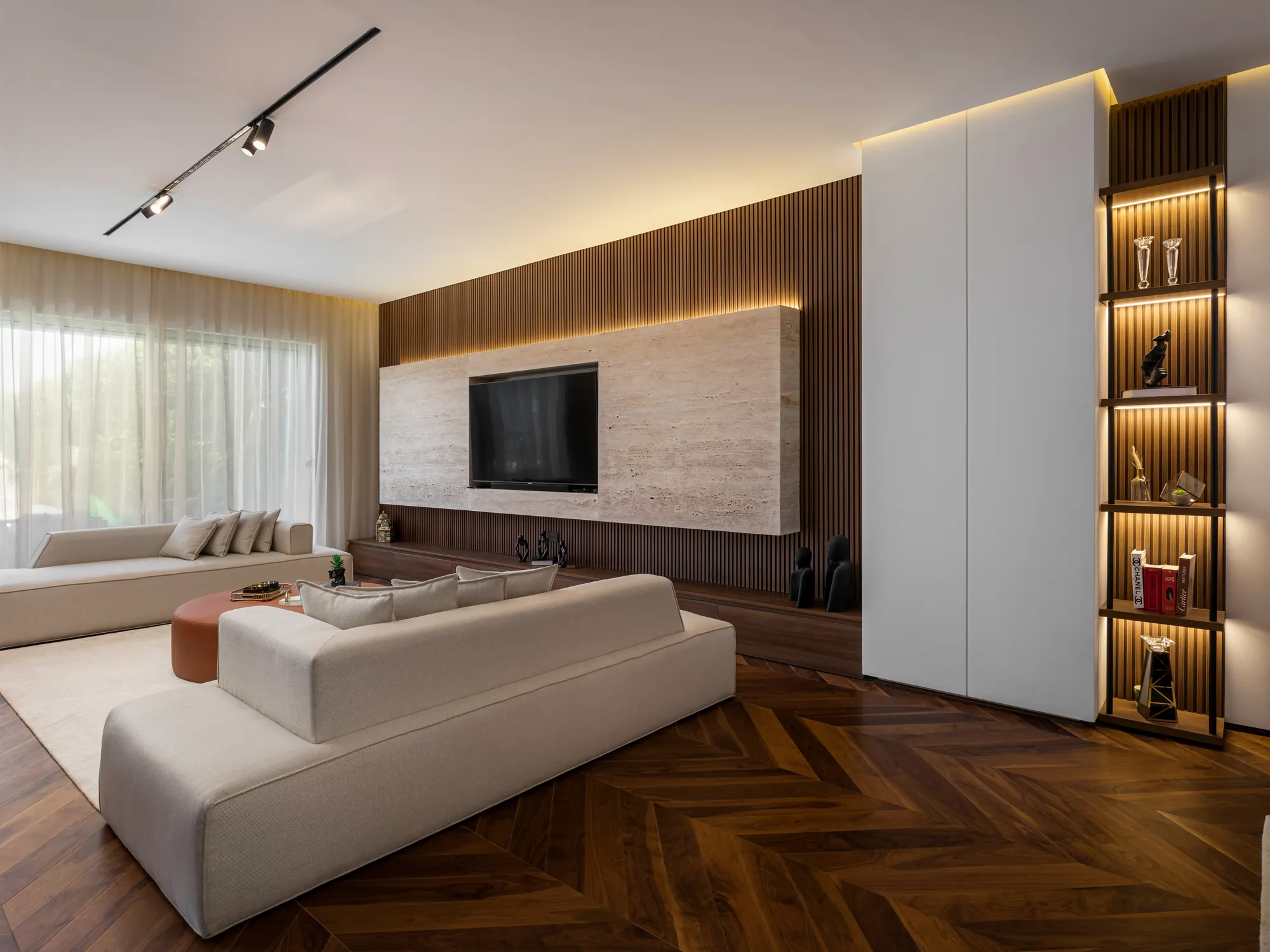 Custom TV unit with travertine backdrop and walnut panelling, New Giza Villa by Modoro