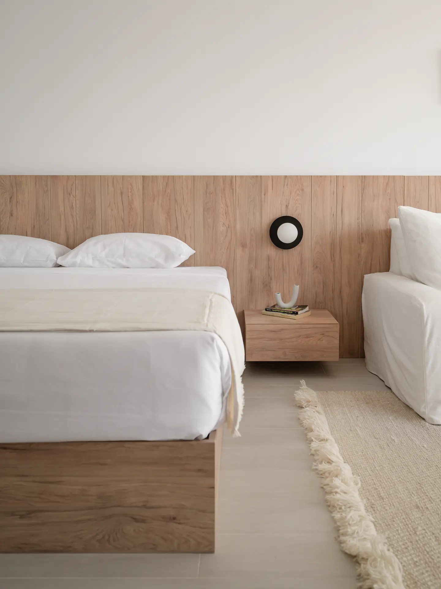 Custom oak bed and bedside joinery, Somabay Lodge by Modoro